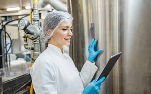 Milk factory plant employee checking quality