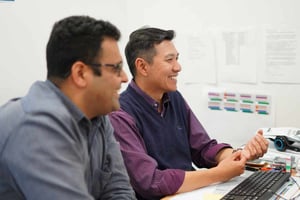 Happy staff looking at computer